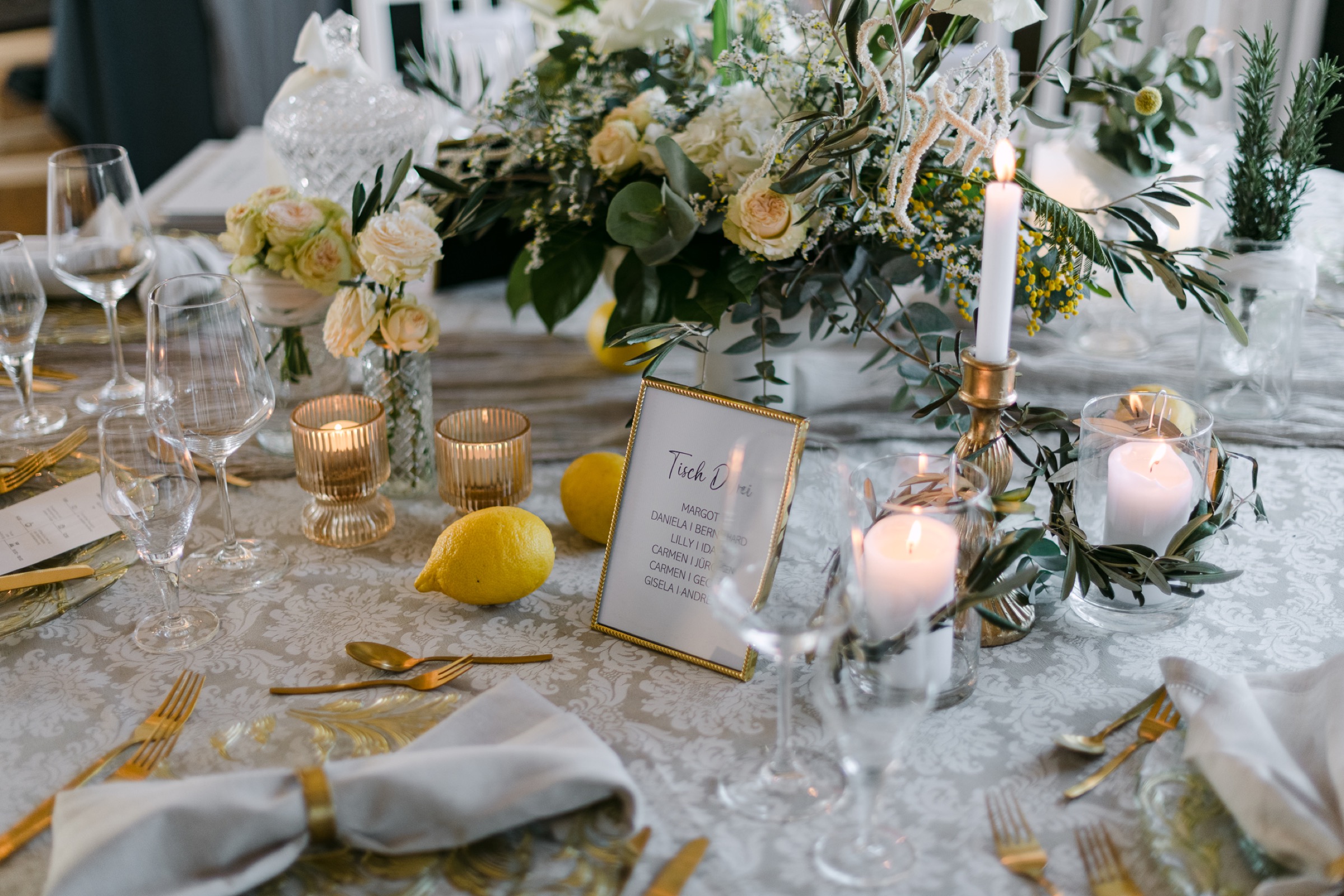 Luxury tablescape with lemons and florals – wedding reception detail photography Saphir Weddings